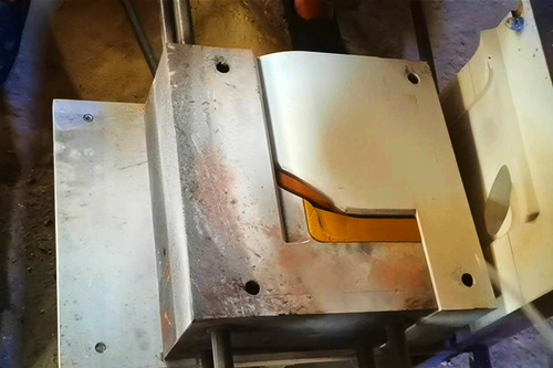 Gravity die casting workshop scene